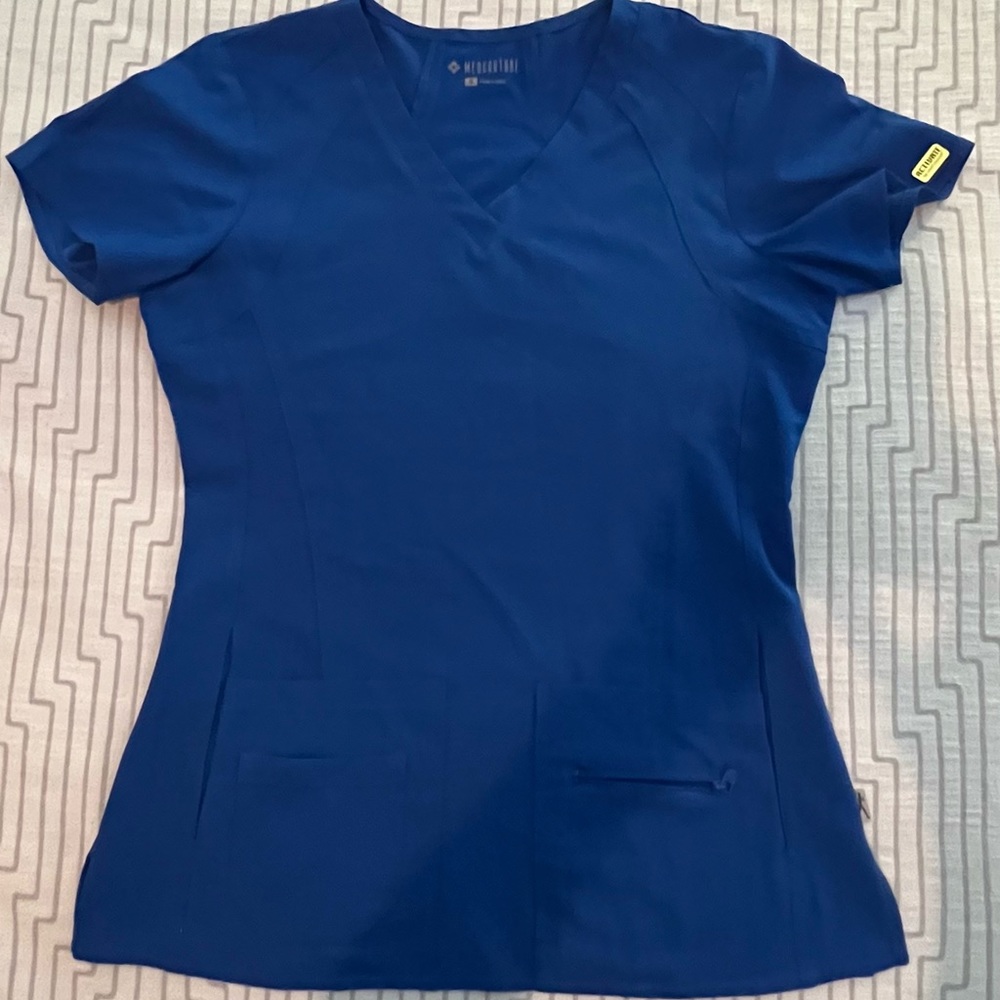 Worn only a few times. Comfortable, flexible, easy clean and dry scrub top